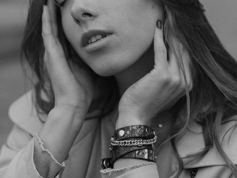 Person in a balanced pose in a bright, airy studio.